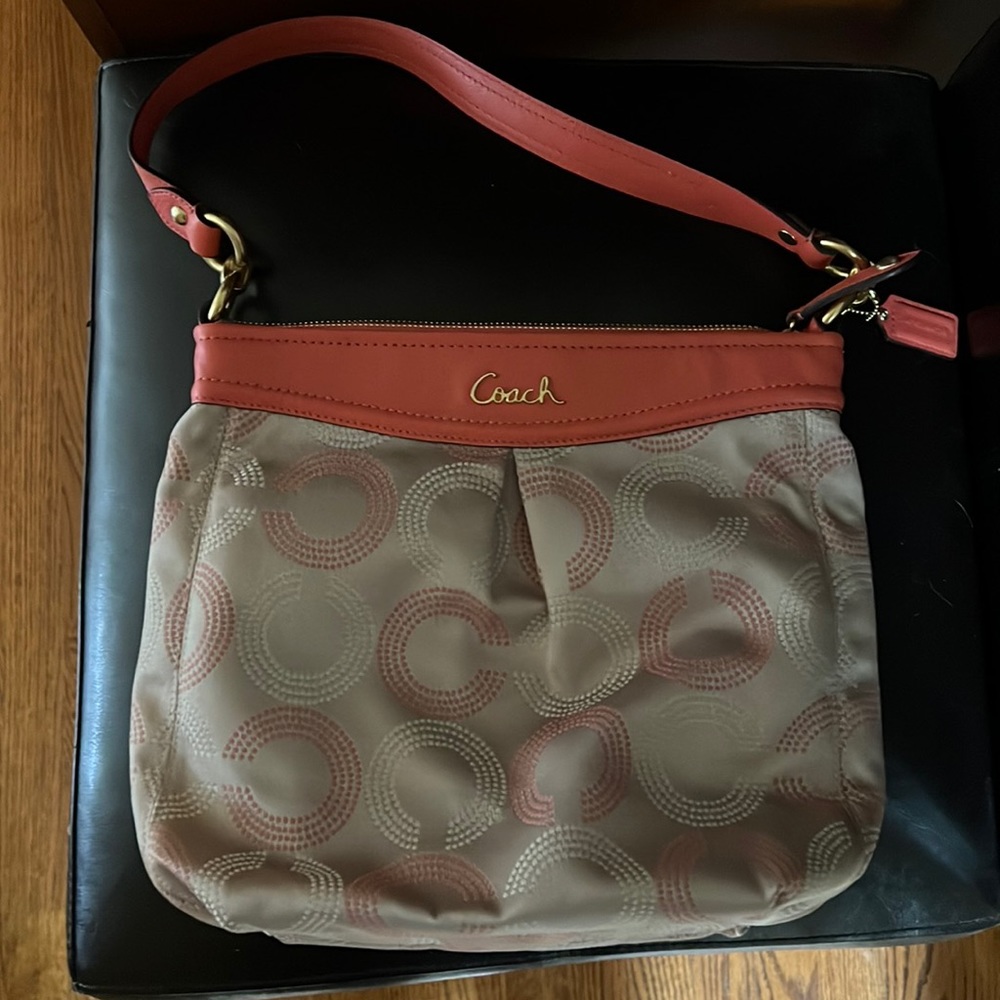 Coach handbag — never used.